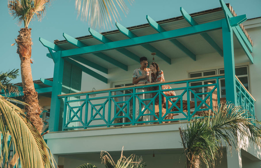 couple on balcony of casita 
