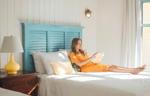 girl reading in bedroom 